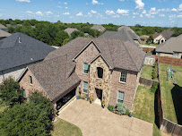 storm damage roof repair Richardson photo
